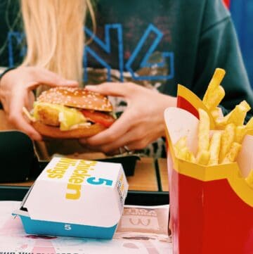 fast-food-chicken-nuggets-french-fries-food-boxes-meal-woman-at-restaurant-chicken-burger-mcdonald-
