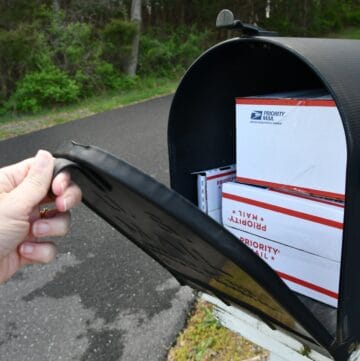 opening-a-mailbox-full-of-boxes-delivered-by-the-mailman-priority-mail-box-package-mail-delivery