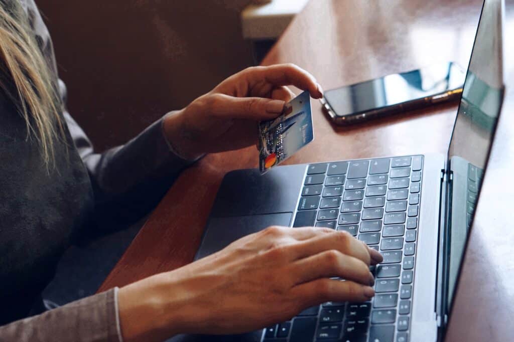 woman on laptop with credit card