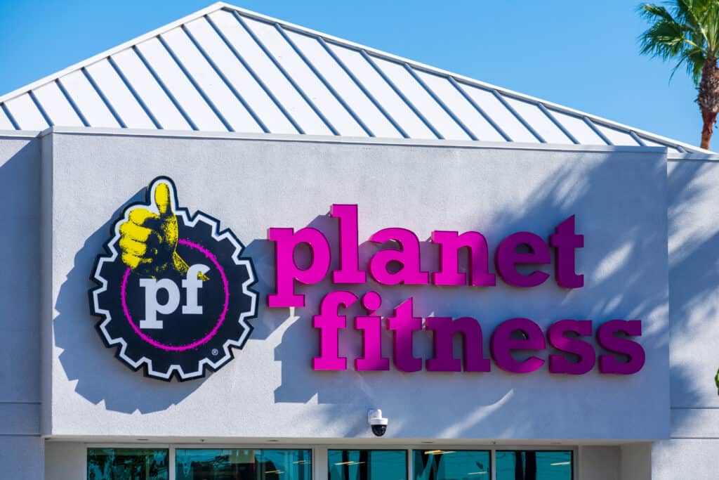 Does Planet Fitness Ever Waive the Startup Fee? - Planet Fitness sign on the fitness club. Planet Fitness is an American franchisor and operator of fitness centers - San Diego, California, USA - 2020